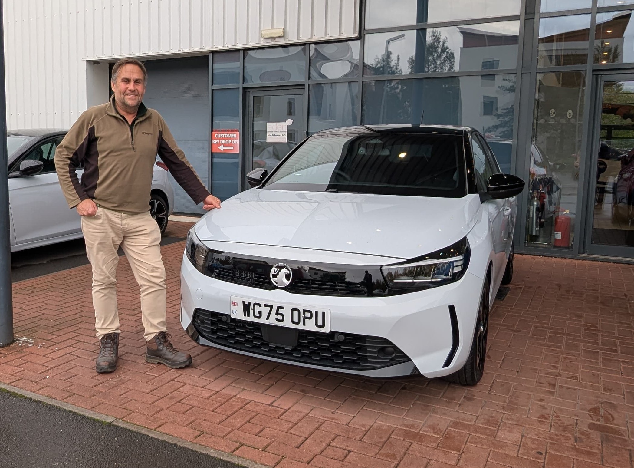 Alistair stood next to his tuition car
